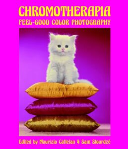 Book cover for "Chromotherapia: Feel-Good Color Photography" which features a white kitten sitting on three silk pillows against a pink background.